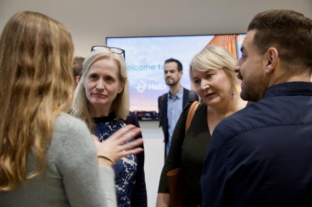 Fellows talking to the Minister